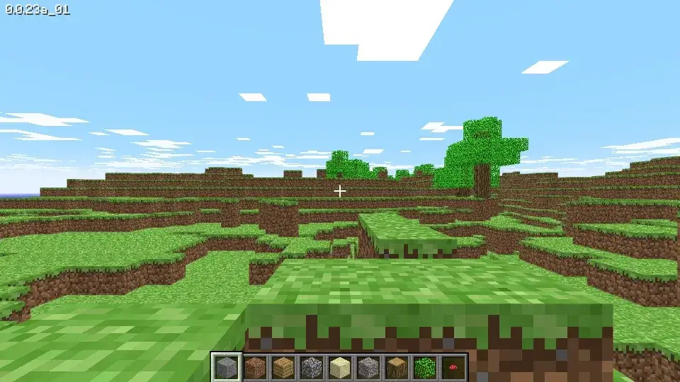 Minecraft Classic browser landscape with grass blocks, trees, blue sky and the block-selection bar